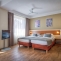 Hotel Aida - Čtyřlůžkový pokoj (Dvojlůžková postel + rozkládací gauč)